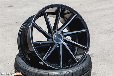 A Black Wheel And Tire Sitting On The Ground