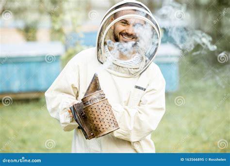 Beekeeper with Bee Smoker on the Apiary Stock Image - Image of farming ...