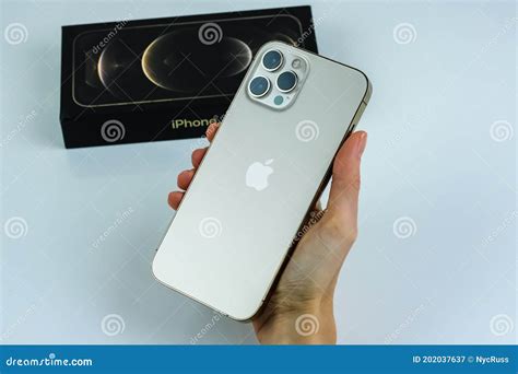 Iphone 12 Pro Max Gold In Customers Hand Editorial Photography Image