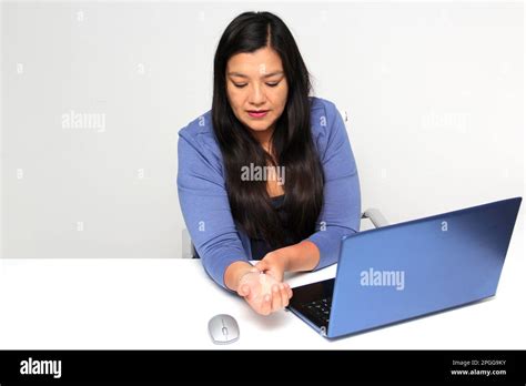 Adult Latina Woman Suffering From Pain Tingling Numbness And Weakness In Her Wrist Due To