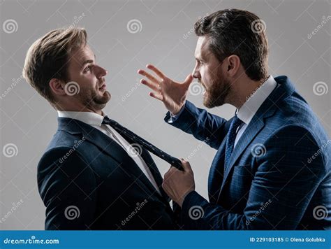 Two Angry Businessmen Fighting And Arguing Having Struggle For