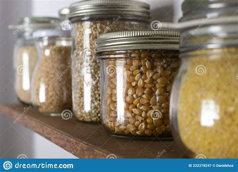 Close Up Of Glass Storage Containers Filled With Grain And Legumes On