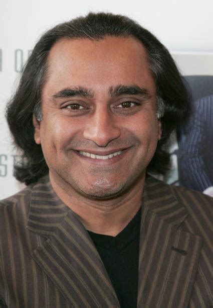 British-Indian comedian and actor Sanjeev Bhaskar poses on the red carpet as he arrives at the ...