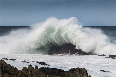 Wave Crashing Onto Rock Causing A Big Splash Stock Photo Image Of