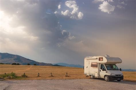 Premium Photo Camper Van On Road Side In Beautiful Landscape Dramatic