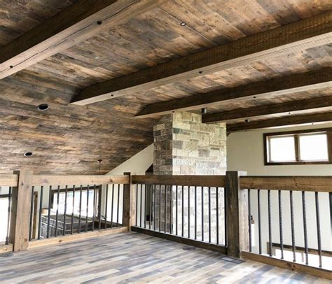 Reclaimed Pine Paneling With Rough Sawn Pine Railing And Timbers