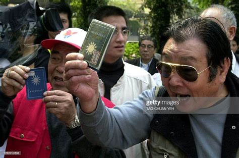 Two 60 Year Old Kuomintang Party Members Display Their Party News