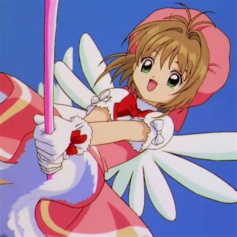 An Anime Character Holding A Pink Object In Her Hand