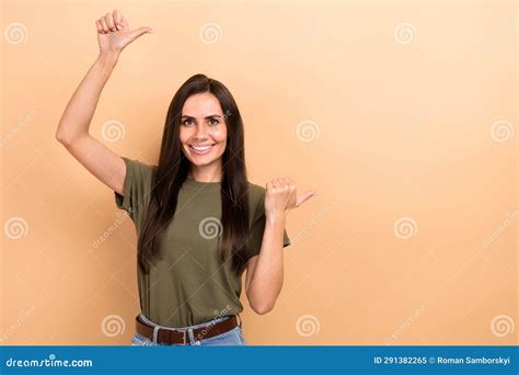 Photo Of Cheerful Cute Girl Dressed Khaki T Shirt Showing Two Thumbs