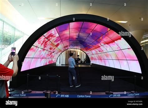 Visitors Take Photos Of The Worlds Largest Oled Tunnel At Canton Tower