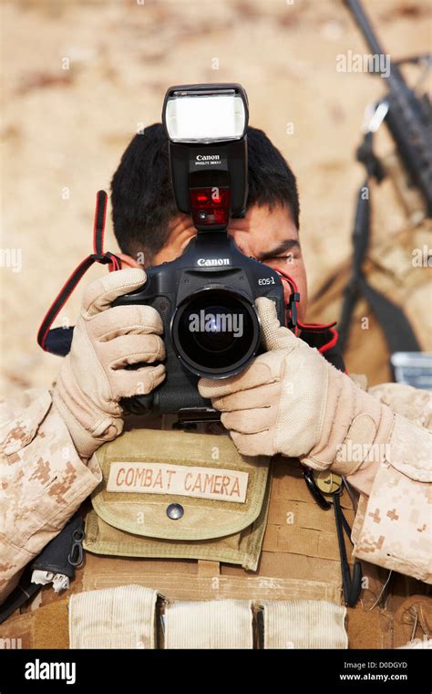 United States Marine Corps Combat Cameraman During A Combat Operation