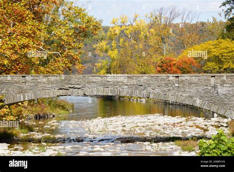 A Bridge Above The Creek Into Cayuga Lake At Taughannock Falls State