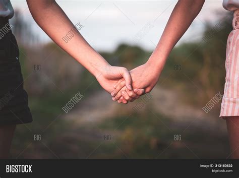 Two Girls In Love Holding Hands