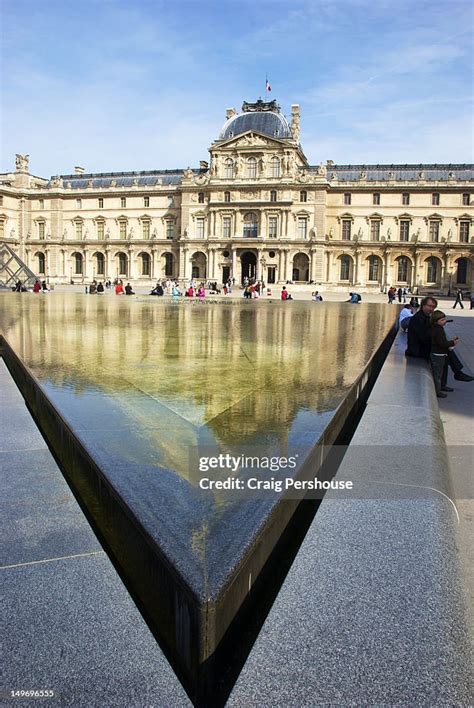 Triangular Fountain In Front Of Louvre Museum High Res Stock Photo