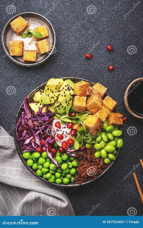 Vegan Buddha Bowl With Red Quinoa Fried Tofu Avocado Edamame Beans Green Peas Radish