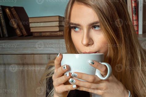 Blonde Drinks A Tea Stock Photo At Vecteezy