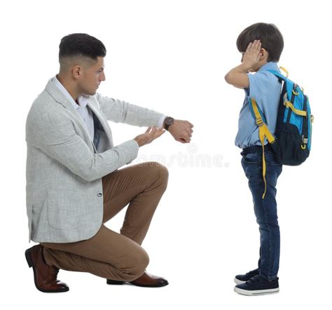 Teacher Pointing On Wrist Watch While Scolding Pupil For Being Late