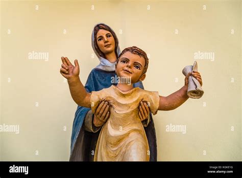 Statue Of The Blessed Virgin Mary Holding Holy Baby Jesus Stock Photo