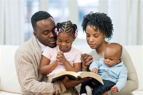 Family Reading Bible Praying Pictures, Images and Stock Photos - iStock