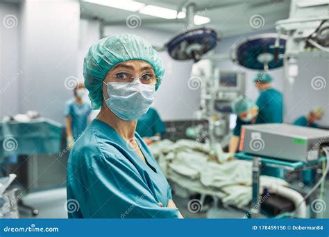 Portrait Of A Female Surgeon Operation In The Background Surgery