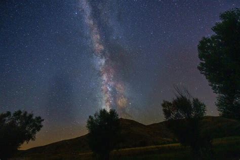 Premium Photo | Dark night sky with many stars above a field