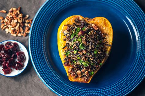 Roasted Acorn Squash With Wild Rice Pecan And Cranberry Stuffing Living On The Vedge