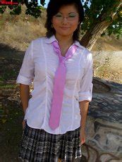 Desirable Brunette Girl Posing In Black Lingerie On The Couch Photos