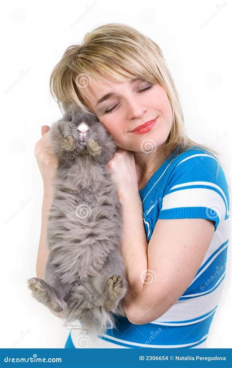 Happy girl hugging a bunny stock photo. Image of girl - 2306654