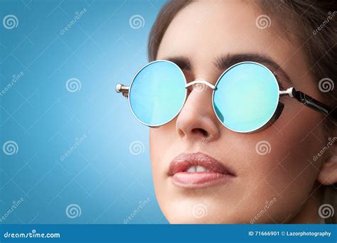 Face Portrait Of Young Beautiful Woman In Round Sunglasses Stock Image