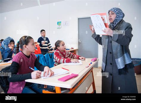 Syrian Refugees At The School With Teacher Hi Res Stock Photography And