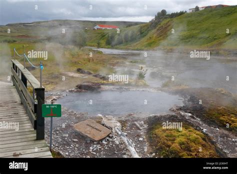 View Of The Secret Lagoon Iceland S Oldest Swimming Pool Iceland Showing Steam From Hot
