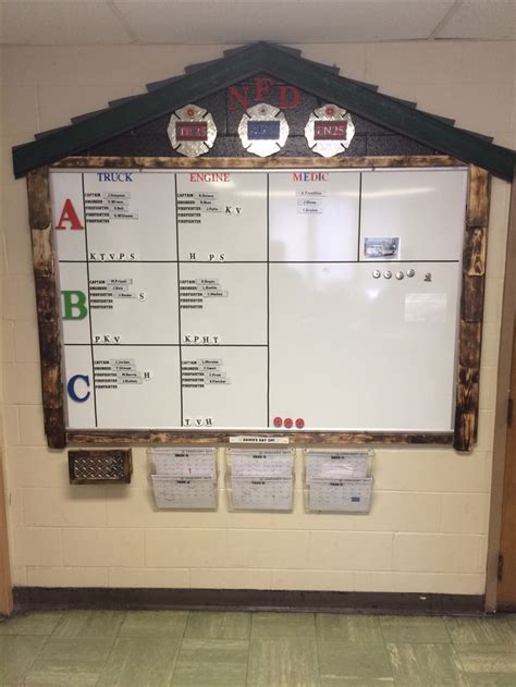 A White Board With Numbers On It In A School Hallway Next To A Tiled Floor