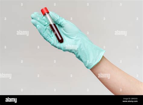 Hand In Latex Glove Holding Blood In Test Tube Close Up Stock Photo Alamy