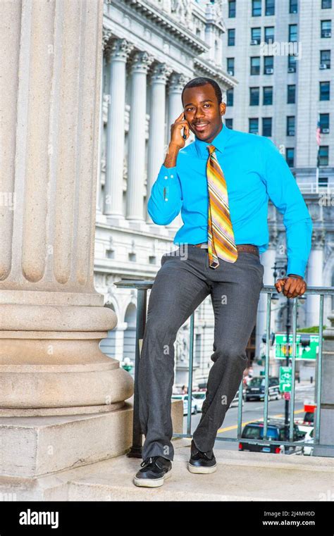 Dressing In A Light Blue Shirt Gray Pants Leather Shoes A Pattern