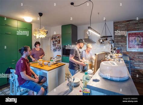 Cooking With Friends At Home Stock Photo Alamy