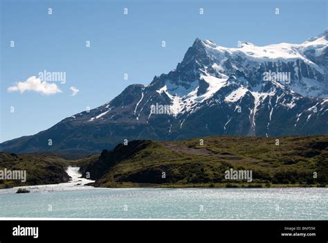 Mountain Covered With Snow At The Seaside Torres Del Paine National