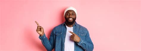 Premium Photo Happy Africanamerican Man Smiling Pointing Fingers