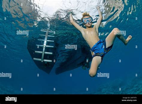 Child Playful In Warm Mediterranean Sea Diving Zakynthos Island