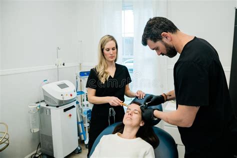 A Woman Getting Botulinum Toxin Or Fillers On Her Forehead And Face By