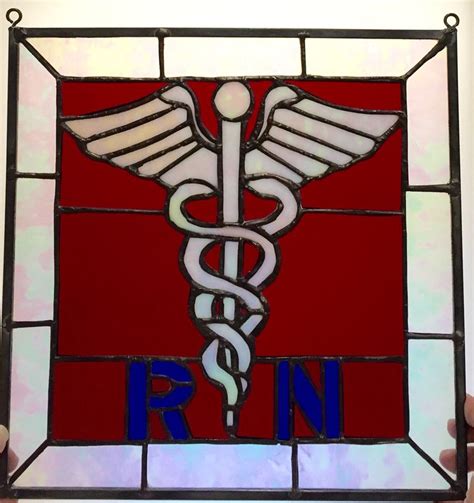 A Stained Glass Window With A Doctor S Symbol On It And The Word Rn