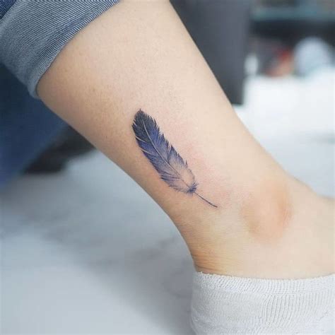 50 Beautiful Feather Tattoo Designs | TattooAdore