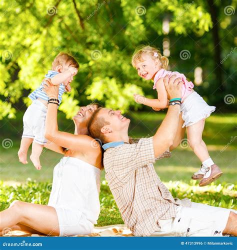 Family playing in the park stock photo. Image of male - 47313996