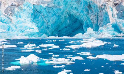 Melting Icebergs By The Coast Of Greenland On A Beautiful Summer Day