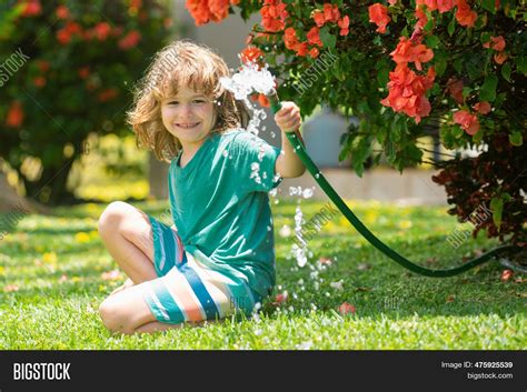 Kids Play Water Garden Image And Photo Free Trial Bigstock