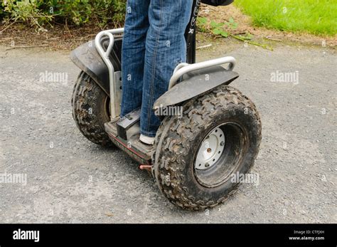 Person standing on a Segway personal transportation Stock Photo - Alamy