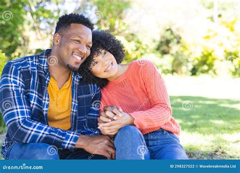 Happy African American Couple Embracing And Holding Hands On Stairs In