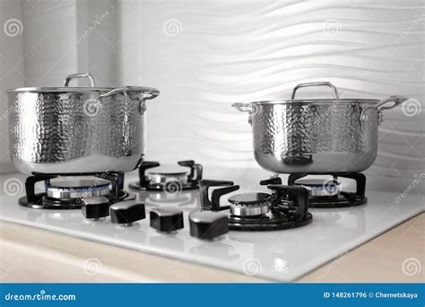 Shiny Steel Saucepans On Gas Stove Stock Photo Image Of Background