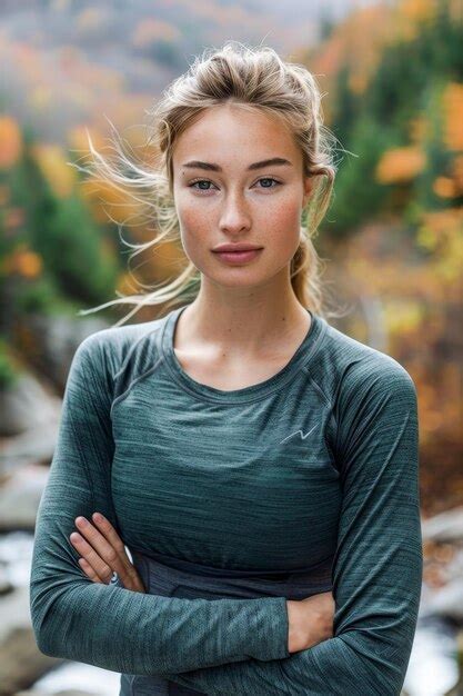 Premium Photo Woman Standing In Front Of River With Arms Crossed