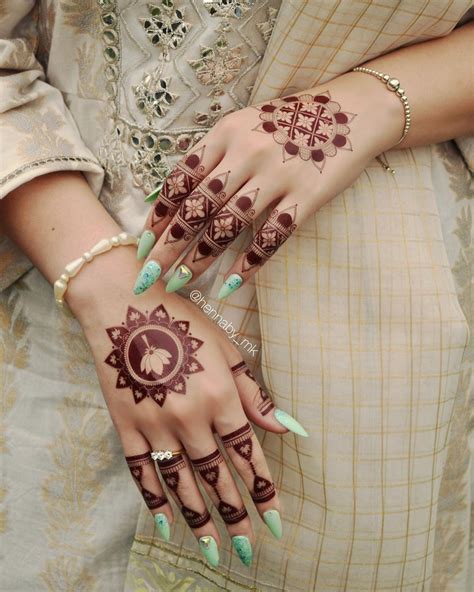 Two Hands With Henna Designs On Them