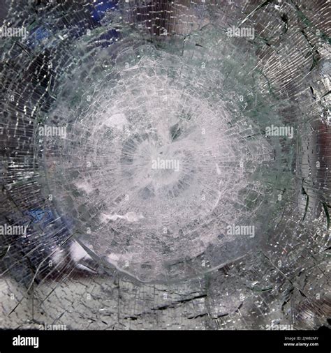 Bulletproof Glass After Test Bulletproof Glass With Cracks And A Crater From A Bullet Hit